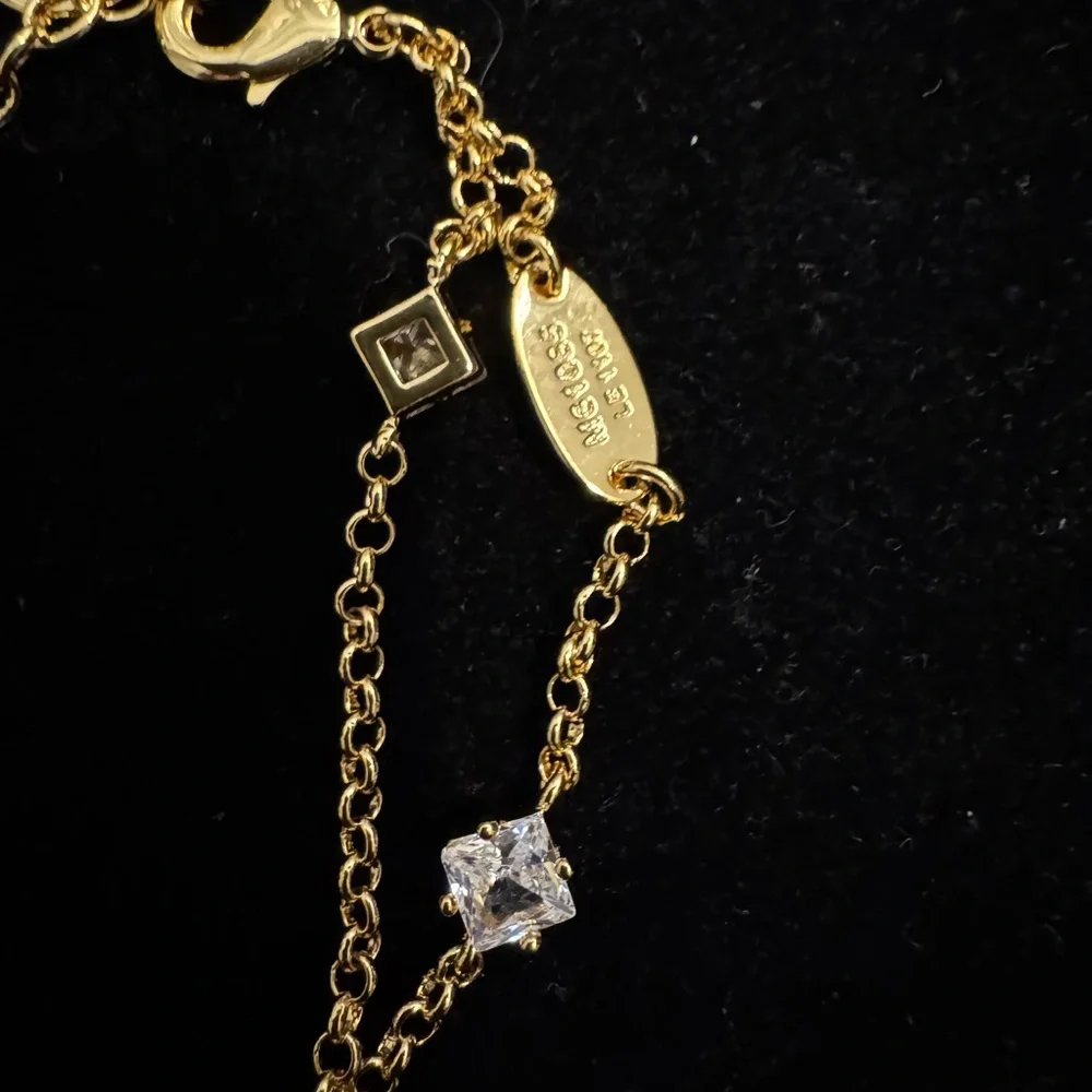 Louis Vuitton Gold and Silver Bracelet with Logo Charms - Picture 4 of 5